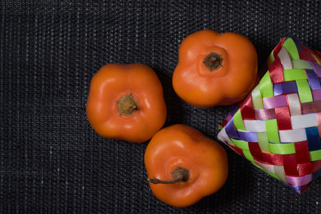 A vibrant display of fresh chili peppers, harvested from Mexico, fills a rustic market. The colorful produce adds heat and spice to any meal for health and well being.の写真素材