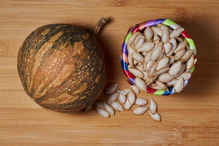 A bountiful basket of freshly harvested pumpkin, seeds providing vibrant color, texture and nutrition for healthy eating.の写真素材