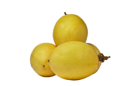 Fresh yellow passion fruits displayed against a white background, showing their smooth textures and vibrant colors, ideal for nutrition, tropical fruit, or health-themed imagery.の写真素材