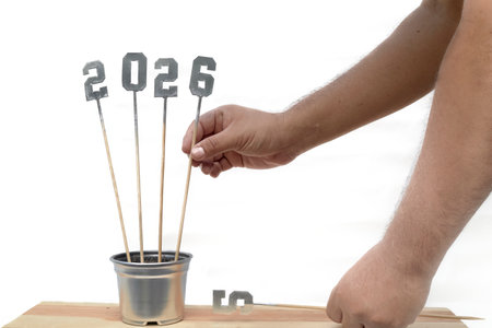 The image captures the anticipation of the New Year's celebration and meal. The numbers 2, 0, 2, and...