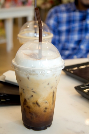 Cappuccino in a cup with a plastic coverの写真素材