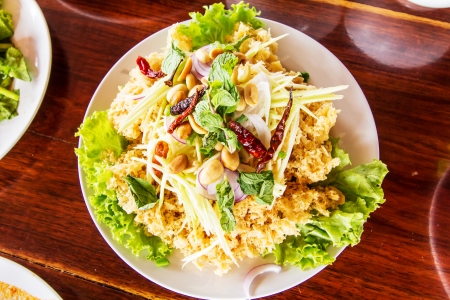 Crispy catfish salad with green mango and vegetable の写真素材