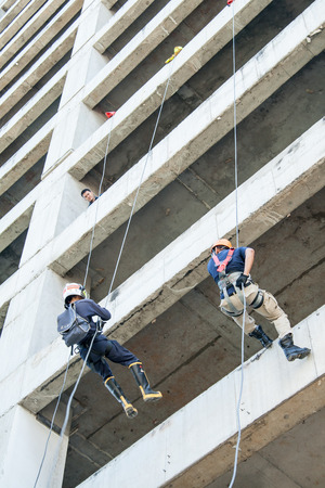 Firefighters practice rappelling on tower. on November 01, 2009 in Talingchan, Bangkok, Thailand.のeditorial素材