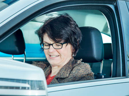 Woman sitting in carの写真素材