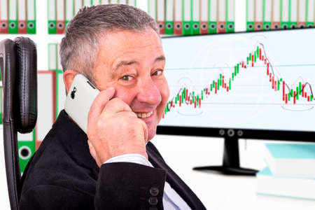Man sitting by the phone at the workplace