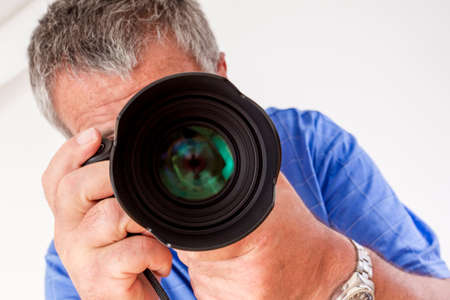 Photographer with a camera when photographing
