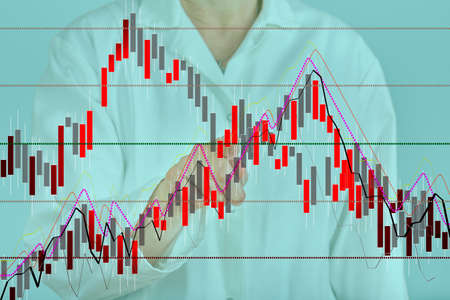 Person in front of chart Person in front of chart