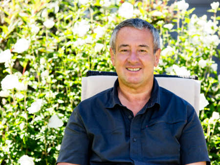 Man sitting on chair in the garden