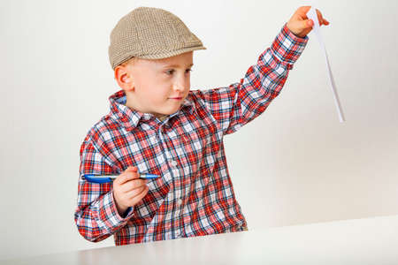 Child with paper and penの写真素材