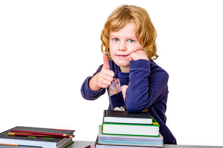 Girl with stack of books and crayons