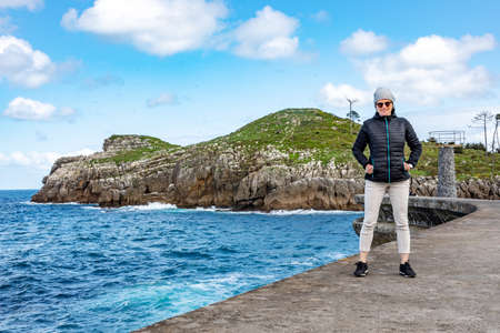 Woman enjoys the lively Atlantic Oceanの写真素材