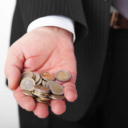 Hand with money coinsの写真素材