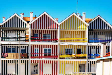 Colorful striped house facades in Portugalの写真素材