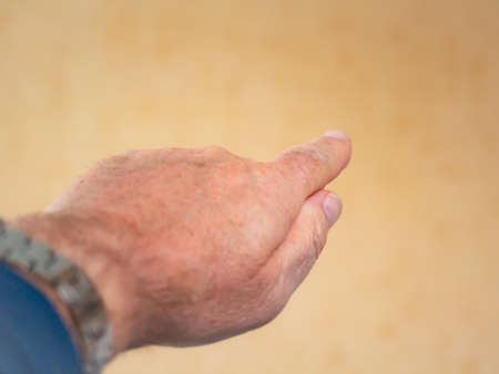 Man's hand with outstretched index fingerの写真素材