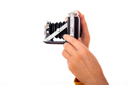 Woman holds nostalgia camera in her hands