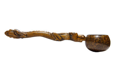 the Coconut shell dipper with dragon handle on white backgroundの写真素材