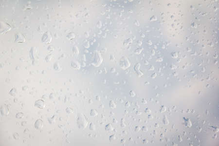 rain drop on the plastic roof with the sun lightの写真素材