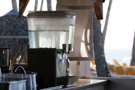 Juice and water pressing machine on the beachの写真素材