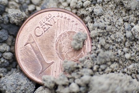 one euro cent coin on the groundの写真素材