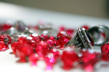 Ruby chain and the ring on the white tableの写真素材