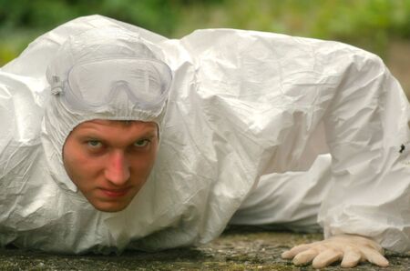 worker on the ground looking worriedの写真素材