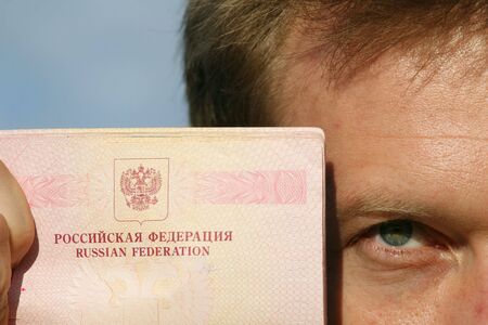 man holding russian passの写真素材