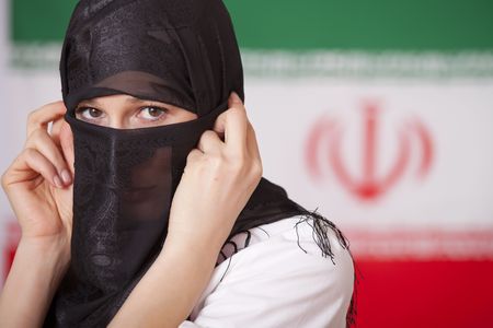 muslim woman in front of iran flagの写真素材