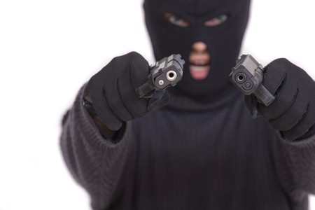 terrorist in balaclava with two guns - isolated on white backgroundの写真素材