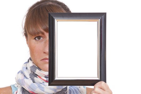 sad woman holding photo frame - isolated on white backgroundの写真素材