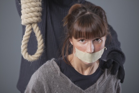 kidnapped woman and hangman with noose over grey background
