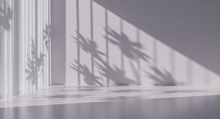 A clean, minimalist white room featuring plant shadows cast by sunlight, creating a serene and modern aesthetic.の素材