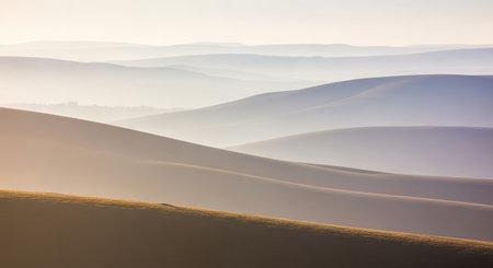 A tranquil scene of rolling hills in Palouse Country, Washington, bathed in the soft light of dawn, creating a peaceful and ethereal atmosphere.の素材