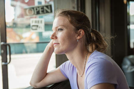 A sign on the door is open and free wi fiの写真素材