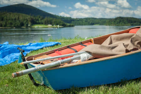 Summer Holidays, sunbathing, swimming, boat on the shore of Lake on the Silesian Harta in Czech...