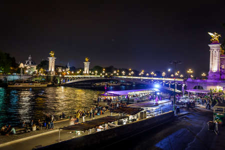 Street on the waterfront of Paris by night in summerの写真素材