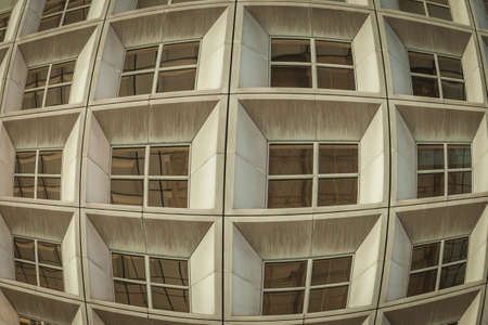 Windows by modern concrete building in a European city