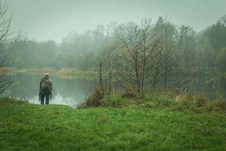 Autumn beauty in the natural lake in cloudy weatherの写真素材