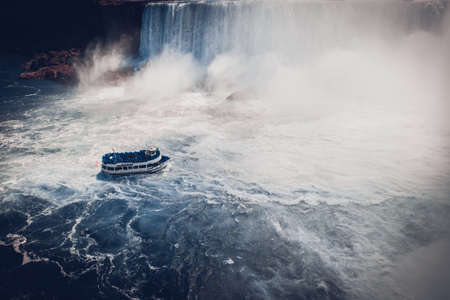 boat with tourists in Niagara Fallsの写真素材