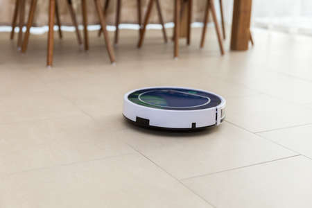 robotic vacuum cleaner cleans rooms in the house