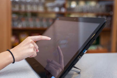 Touchscreen's cash register in the restaurant and commerce storeの写真素材