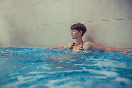 Young woman enjoys wellness and spaの写真素材