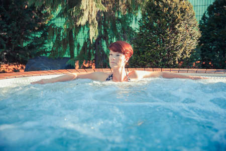 Young woman enjoys wellness and spa