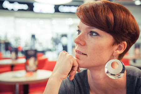 portrait of a young woman in a caf