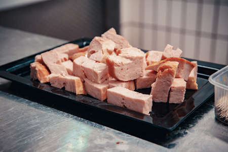 Production of meat products in the supermarket in the supermarket. Next, distribution of finished products to the stores shop for customers. Sausage, meatloaf, pate ...の写真素材