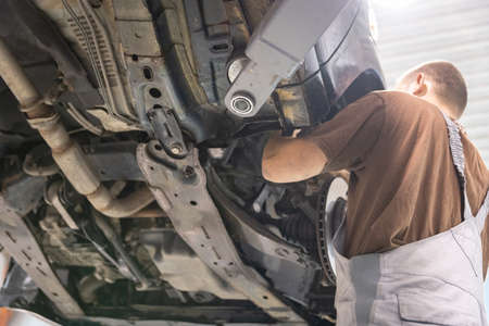 Repair and check car in repair shop. An experienced technician repairs the faulty part of the car. I...