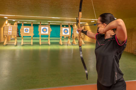 archery in the sports hall and in nature. Competition for the best shot an arrow into targets. tournamentの写真素材