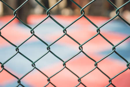 Gorgeous woman, mma fighter in gym during training. Preparing for a hard caged match. Sexy fighter...