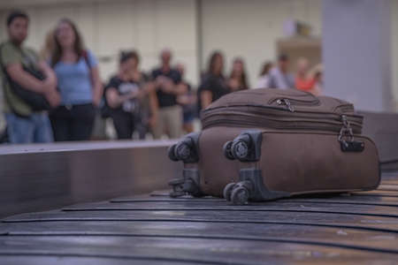 passengers are waiting for luggage at the passport in the airport lobby.の写真素材