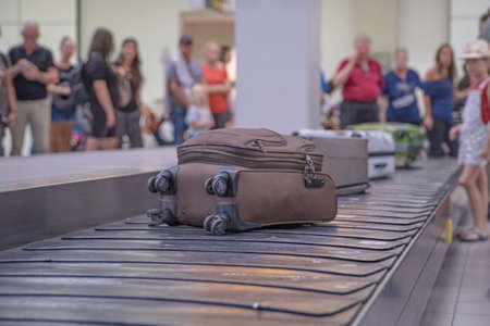 passengers are waiting for luggage at the passport in the airport lobby.の写真素材