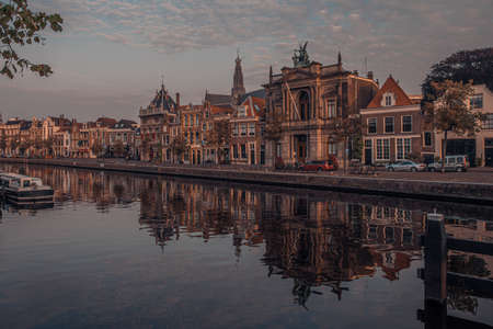 Sunrise over a canal at a windmill in the Netherlands Amsterdam in summerの写真素材